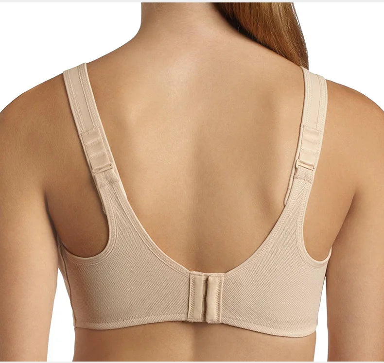 Beige underwire bra worn by a model on a white background