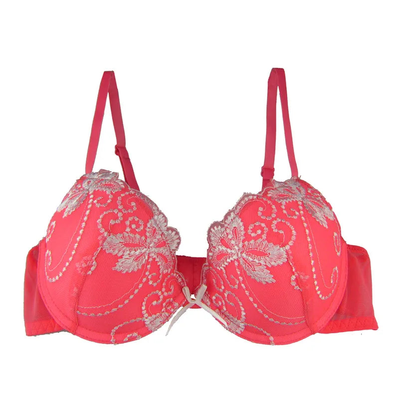 Red bra with floral embroidery on a white background