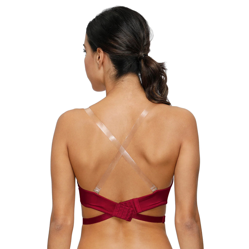 Woman wearing a red bikini with thin straps on a white background