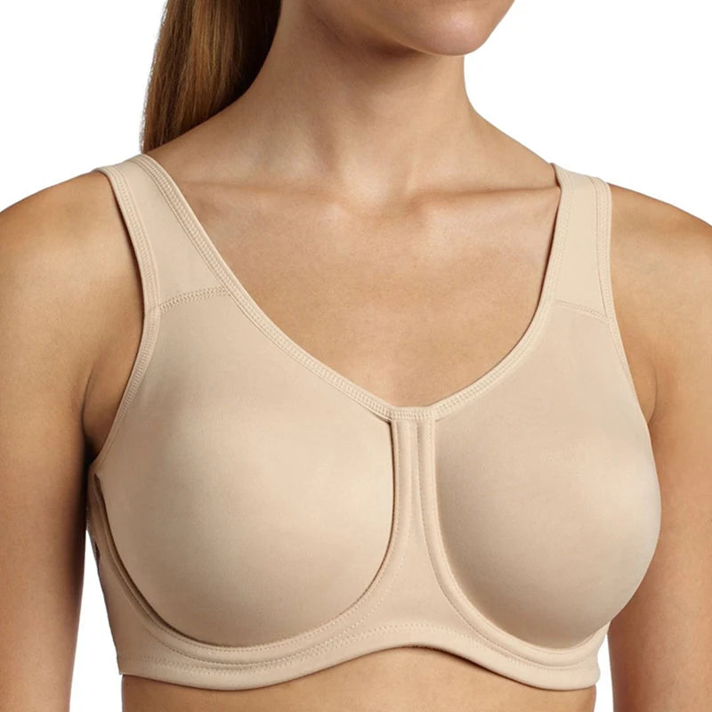Beige bra worn by a person on a white background