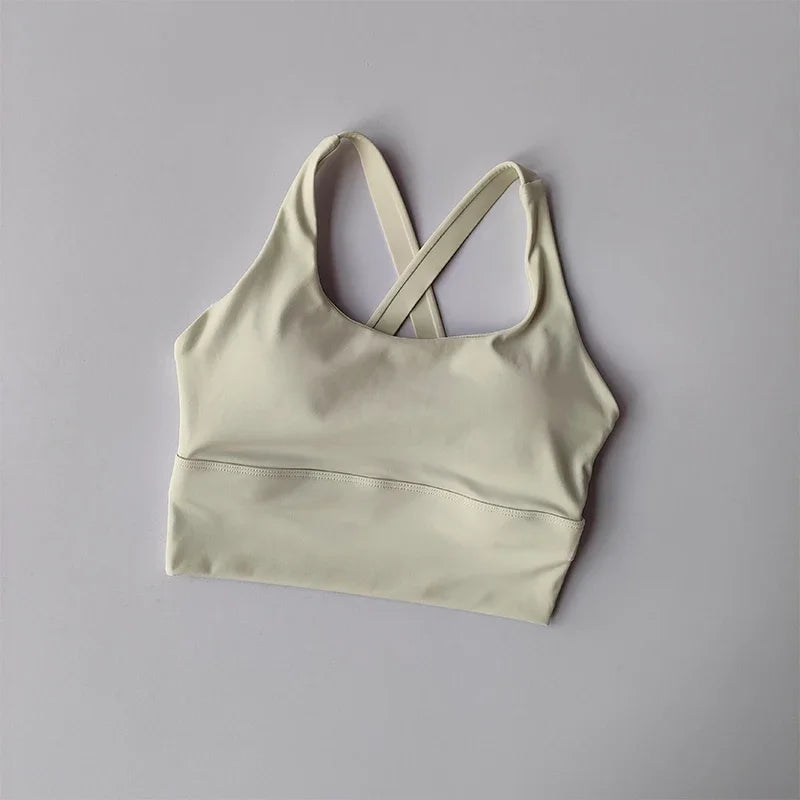 Light green sports bra on a gray background