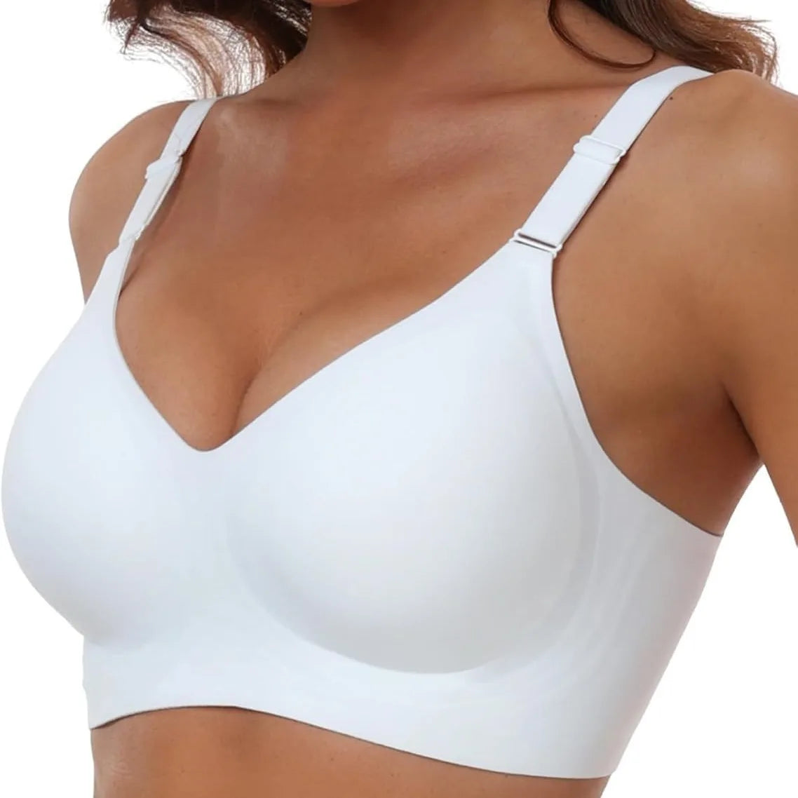 White bra worn by a person on a white background