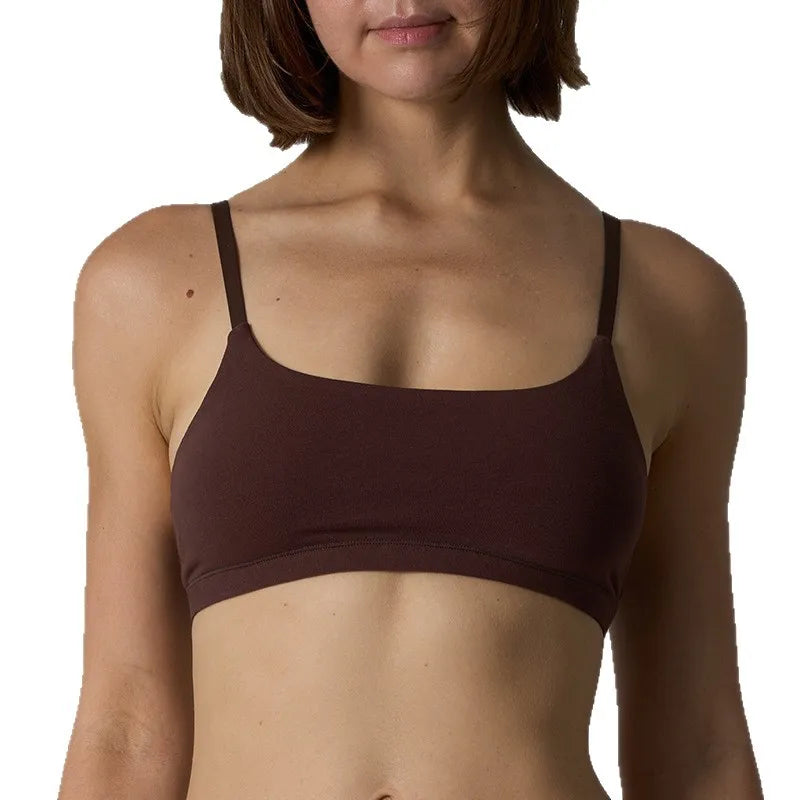 A woman wearing a dark brown scoop-neck bralette with thin straps, shown from the neck to the mid-torso against a plain white background.