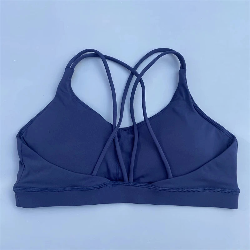 Navy blue bikini top on a light blue background