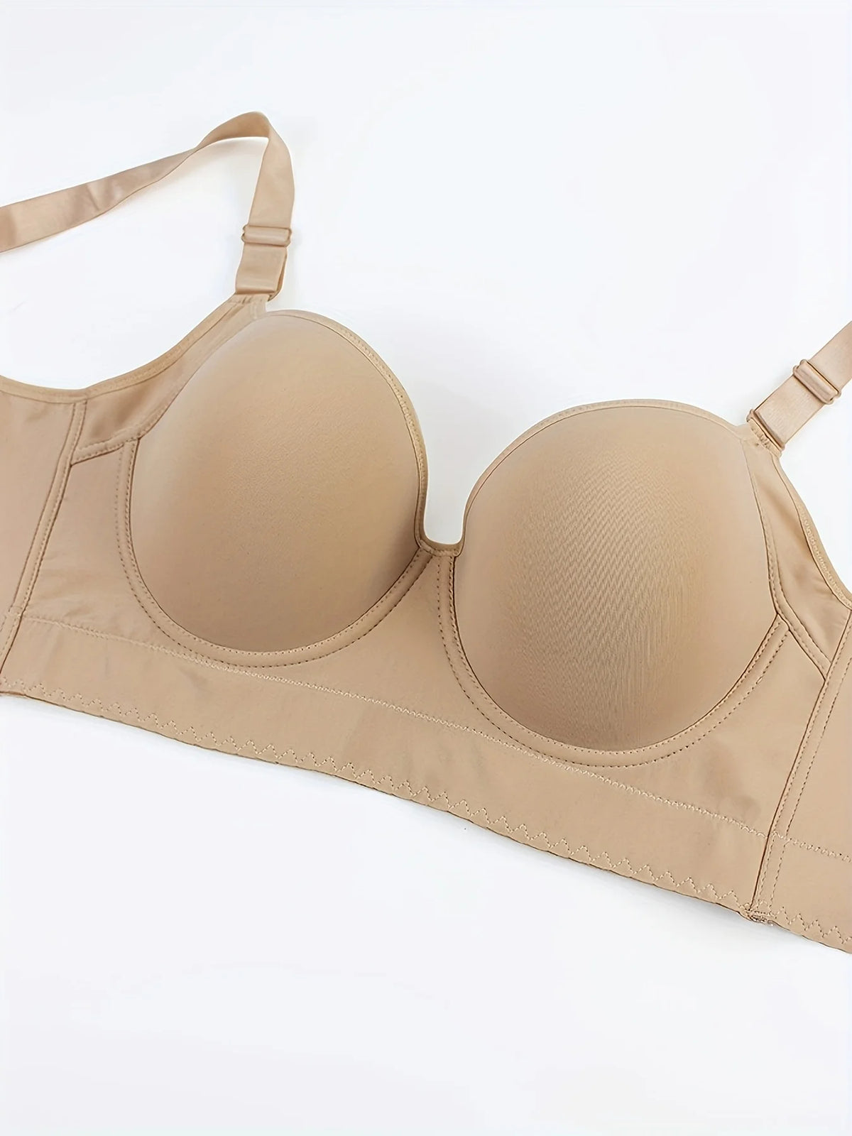 Beige bra on a white background
