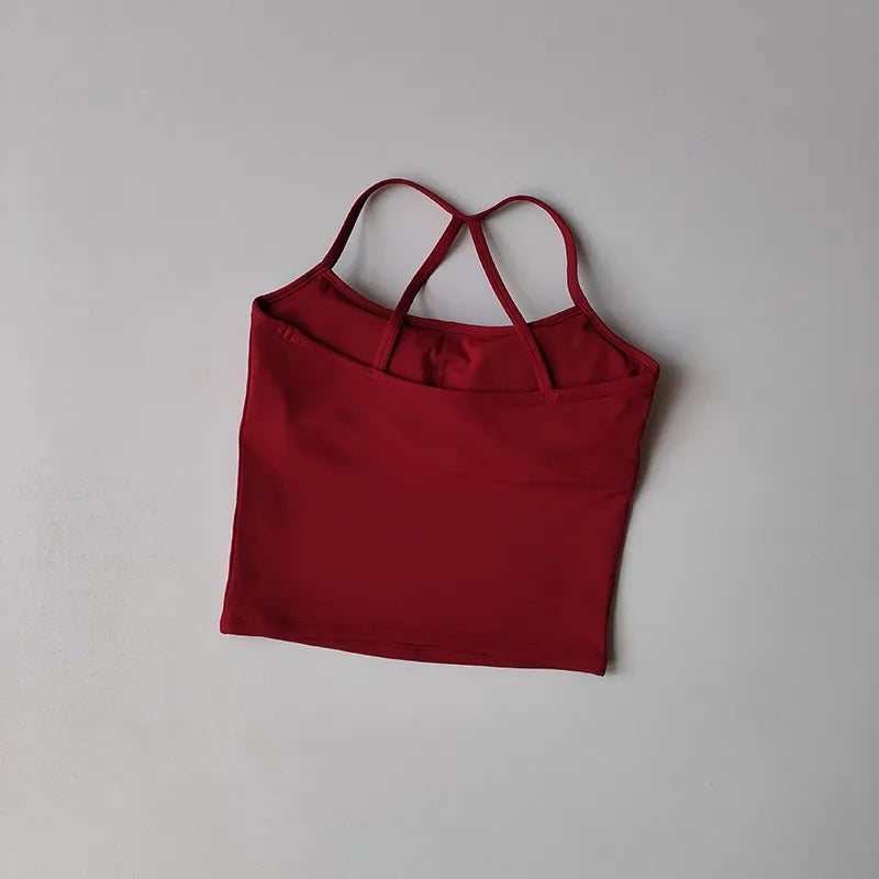 Red tank top with thin straps on a gray background