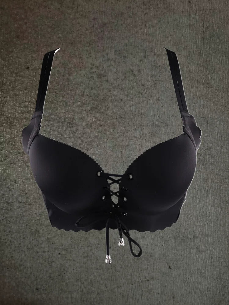 Black bra on a textured gray background