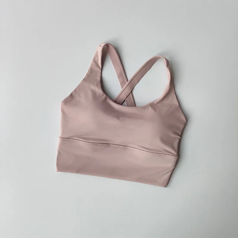 Pink sports bra on a light gray background