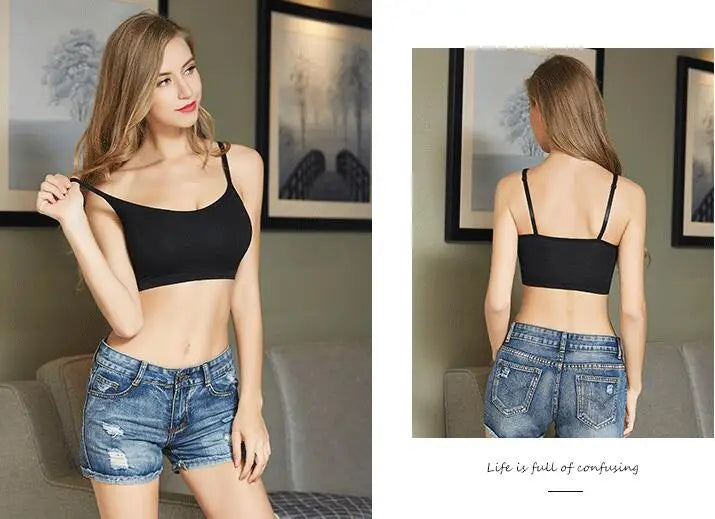A woman modeling a black strappy crop top bra in two views: a front-facing pose on the left and a back-facing pose on the right, paired with distressed denim shorts in an indoor setting.