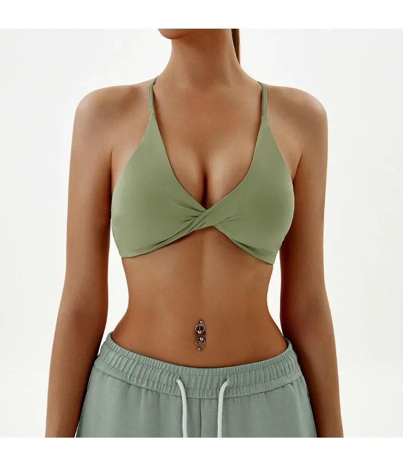 Person wearing a green bikini top and matching pants on a white background