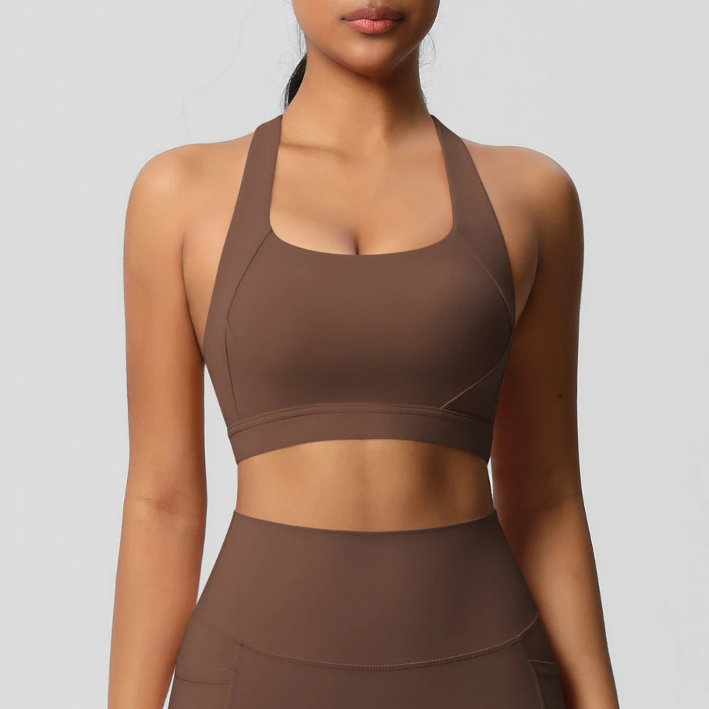 Brown sports bra and leggings on a plain background