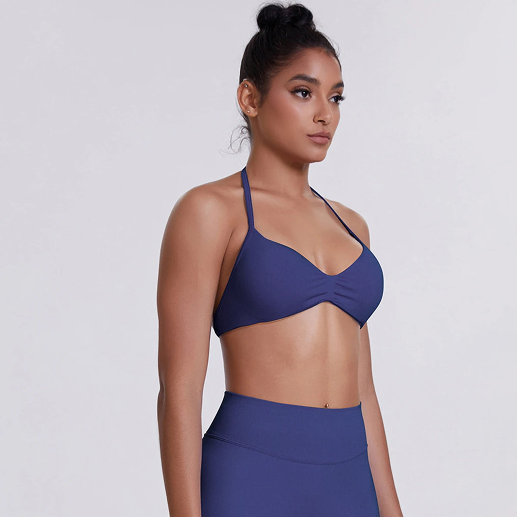 Woman wearing a blue bikini top and skirt on a white background