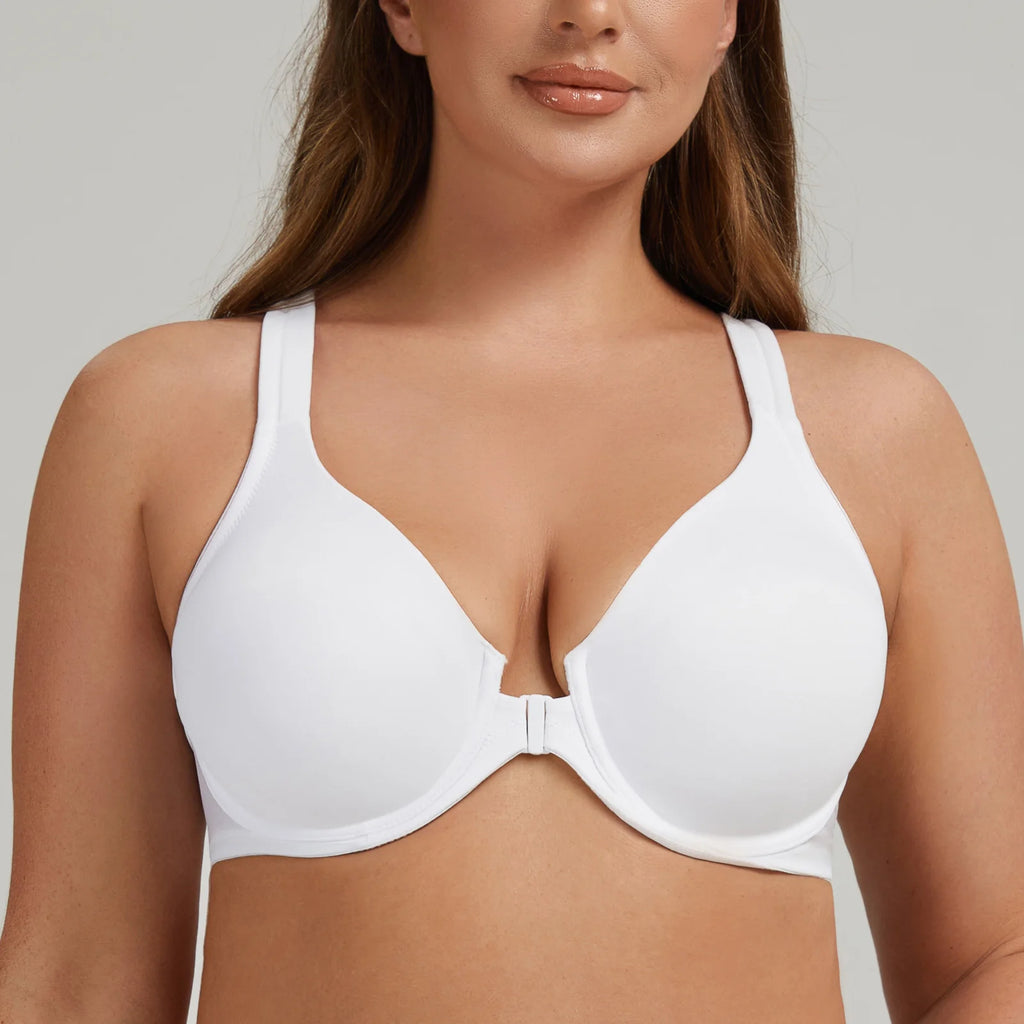 Woman wearing a white bra against a neutral background