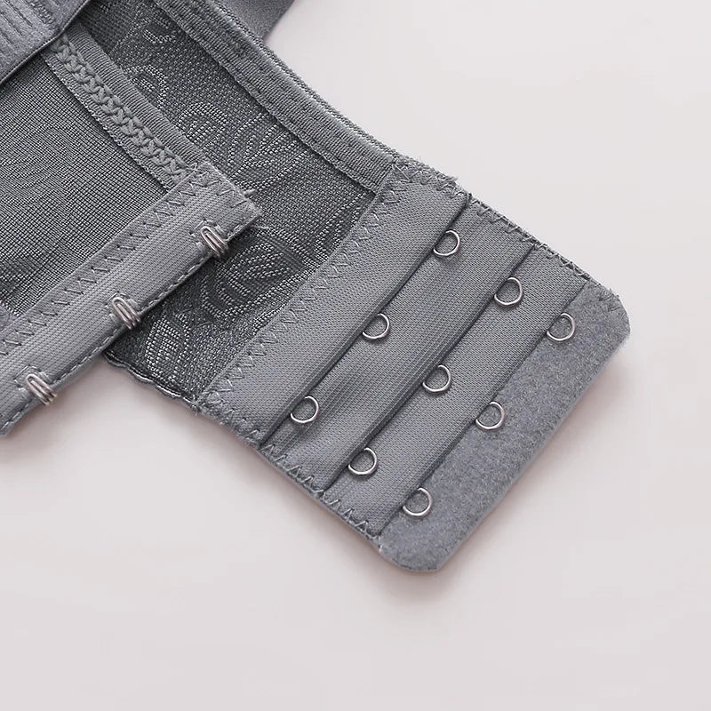 Gray bra with adjustable straps on a light gray background