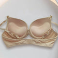 Beige bra on a white background