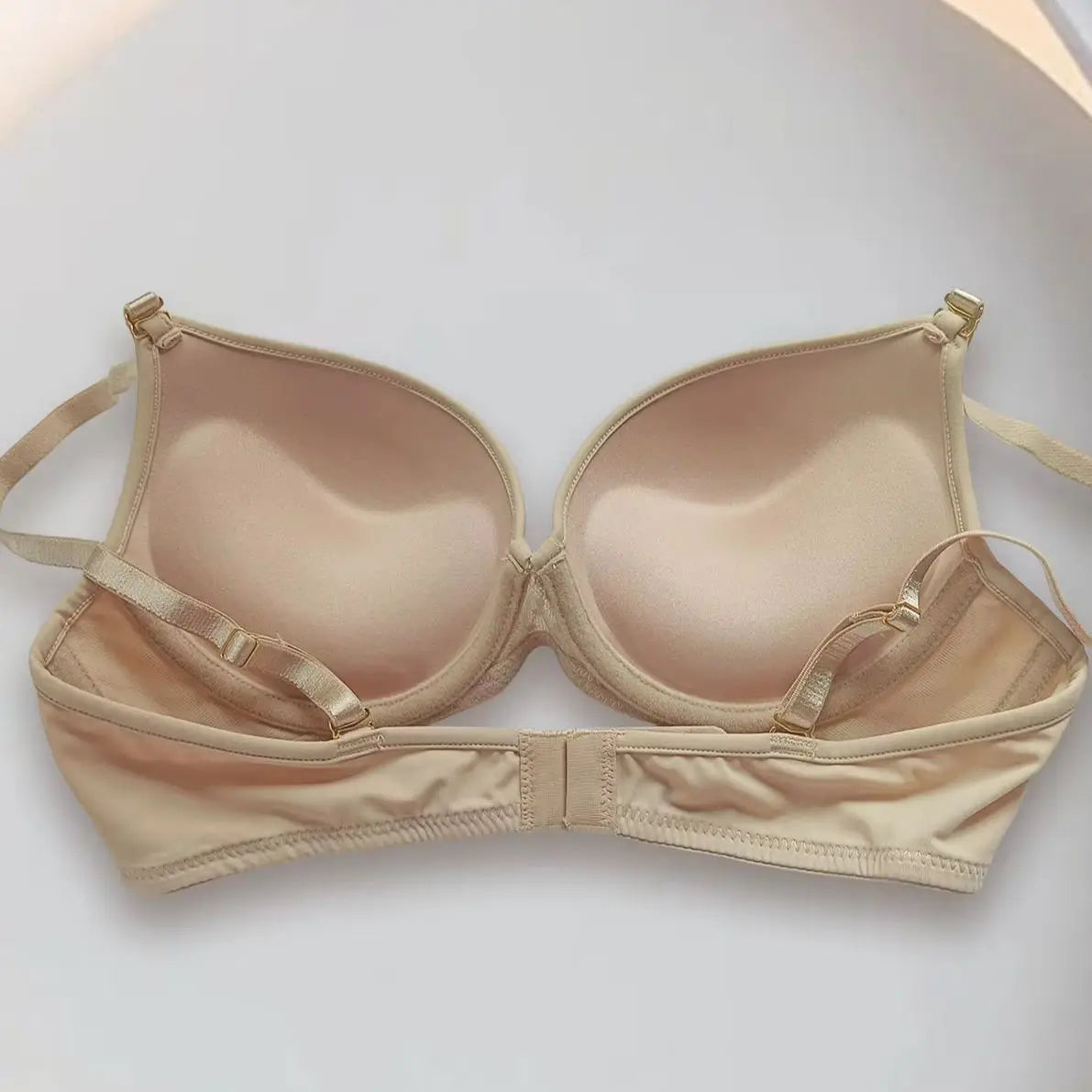 Beige bra on a white background
