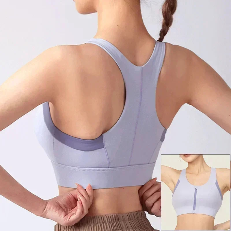Light gray sports bra worn by a person on a plain background