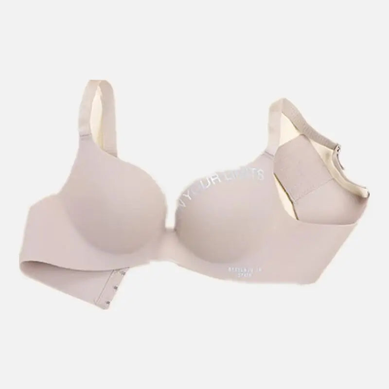 Beige bra with 'Mia' branding on a white background