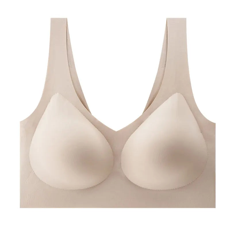 A beige wireless bra with seamless molded teardrop-shaped cups and wide shoulder straps, shown against a plain white background.