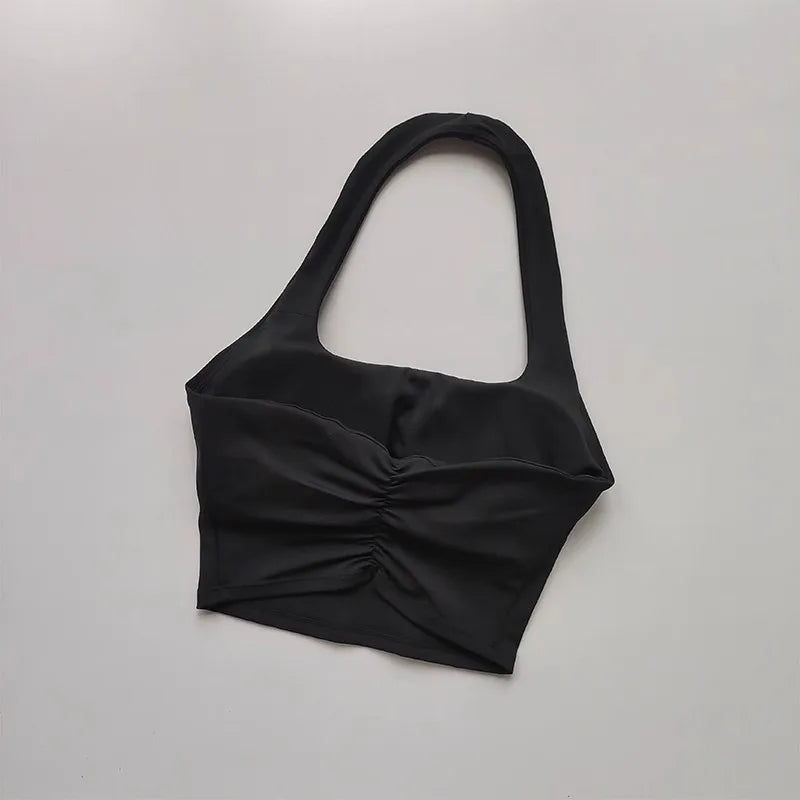 Black halter top on a light gray background