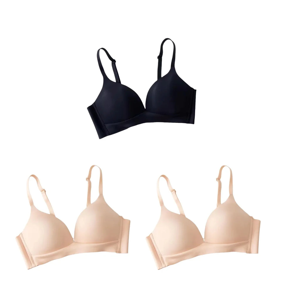 Black and beige bras on a white background