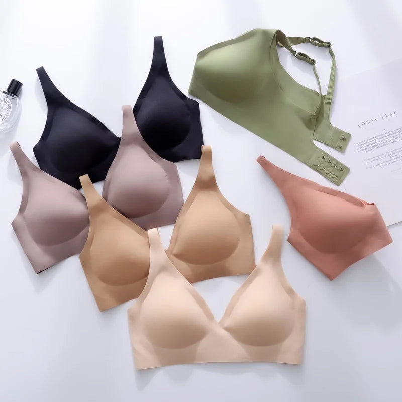 Collection of various bras in different colors on a white background