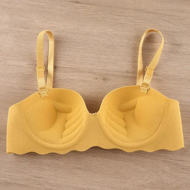Yellow bra on a wooden background