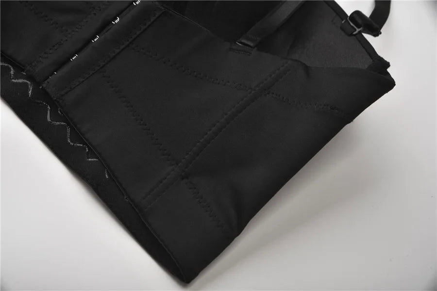 Close-up of black fabric with stitching details on a white background