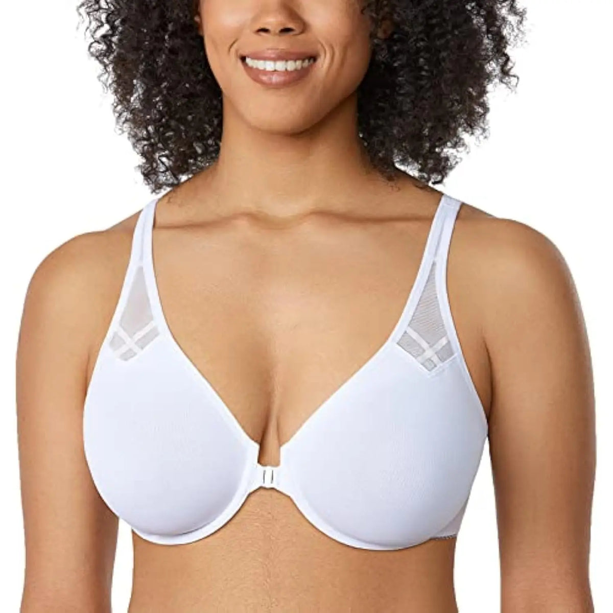Woman wearing a white bra with a plain background