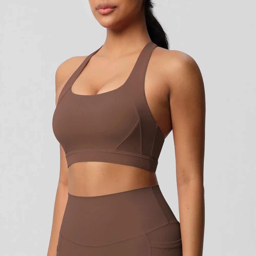 Brown sports bra and leggings on a plain background
