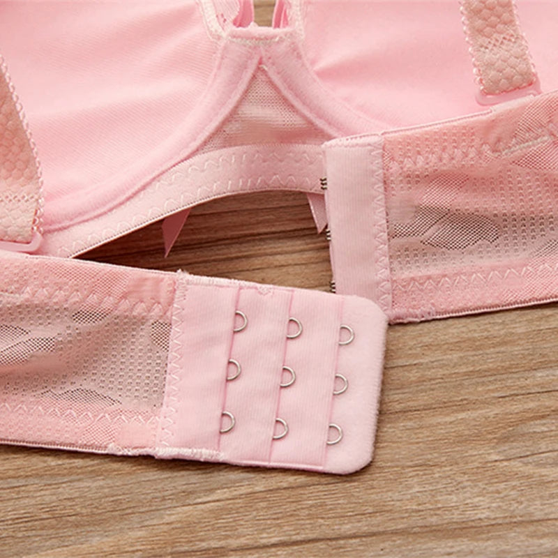 Close-up of a pink bra on a wooden surface