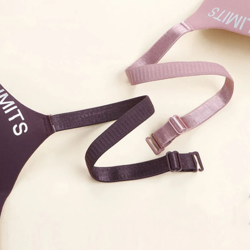 Purple and pink harnesses with visible branding on a light background
