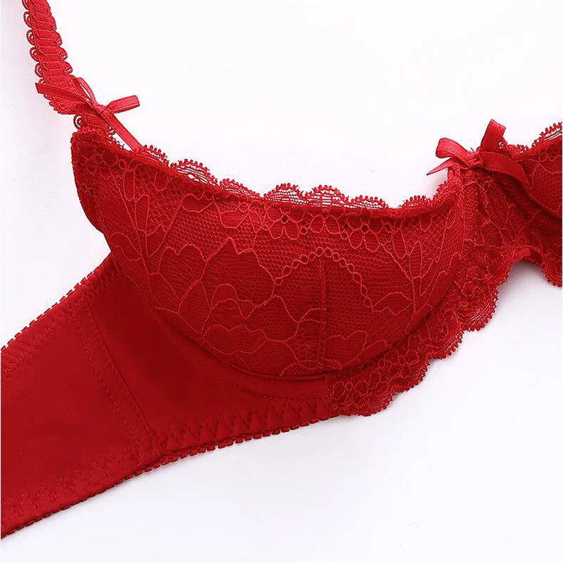Red lace bra on a white background