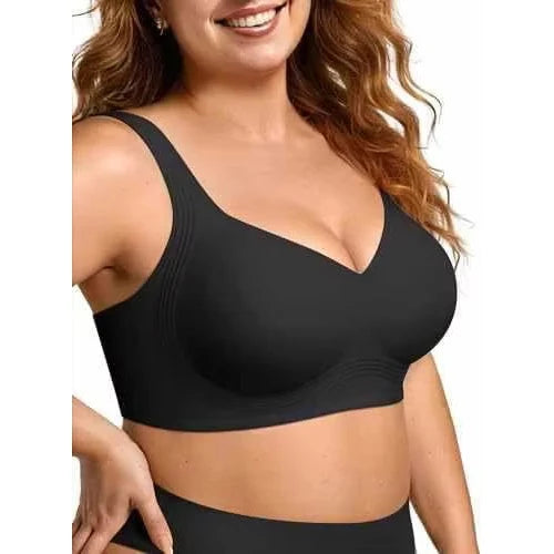 Woman wearing a black sports bra on a white background