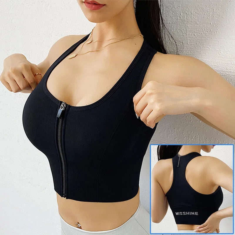 Black shapewear top with zipper detail worn by a person, on a plain background.