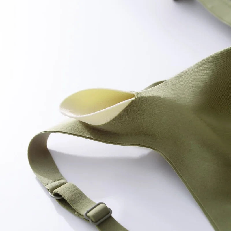 Green apron with a white spoon on a white background