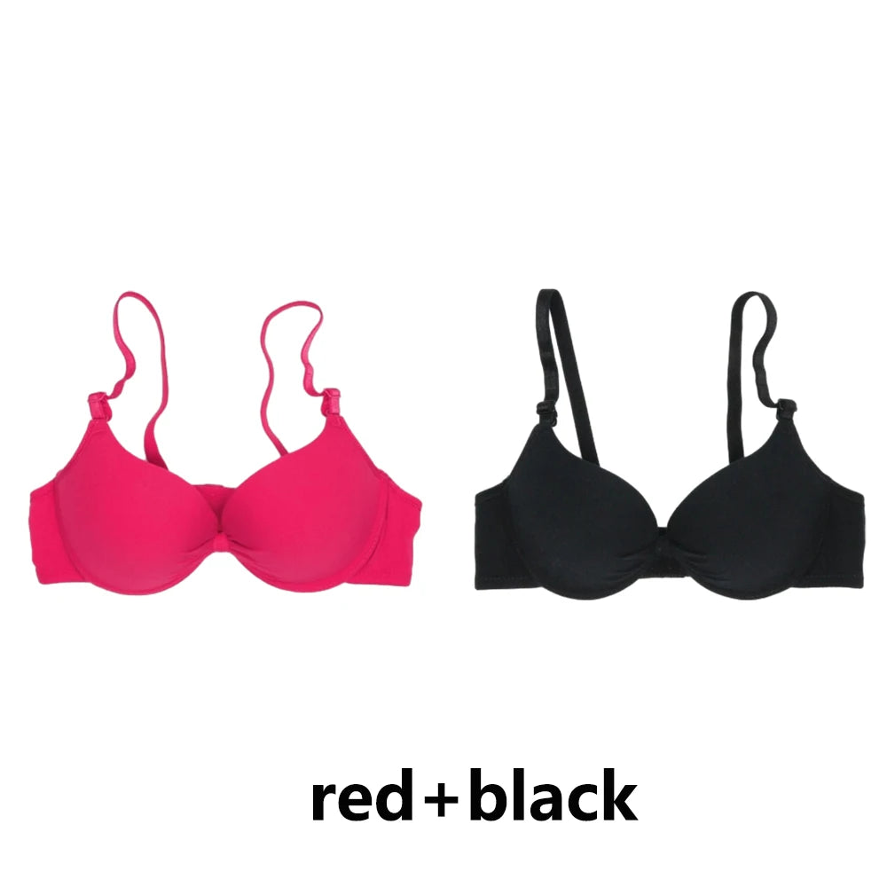 Two bras, one pink and one black, on a white background with 'red + black' text.