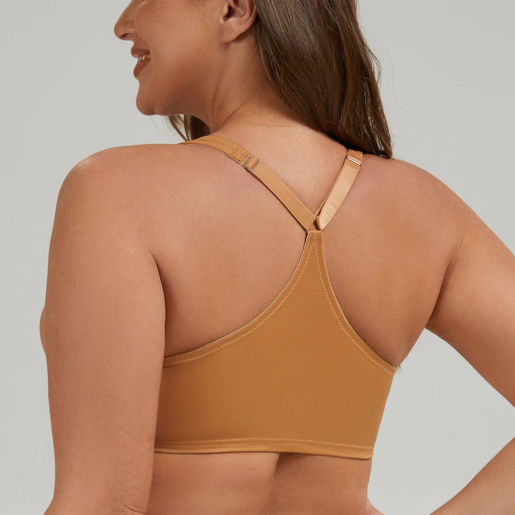Woman wearing a brown sports bra against a neutral background