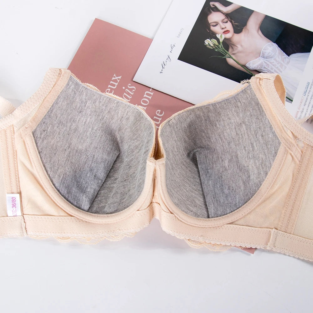 Beige bra with gray cushions on a white background