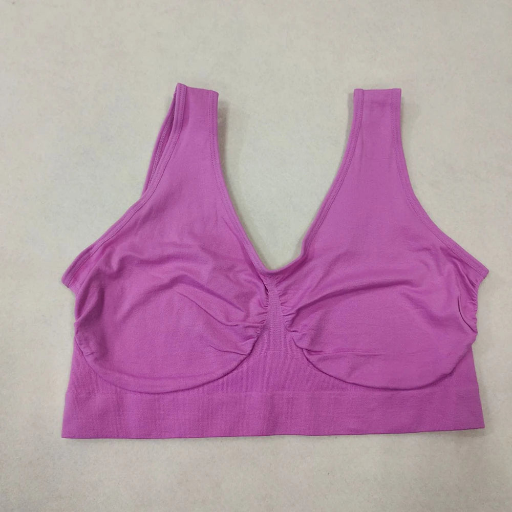Purple sports bra on a beige background