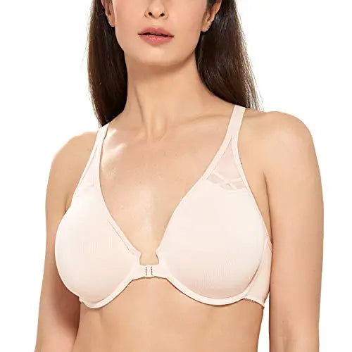 Woman wearing a beige bra on a white background