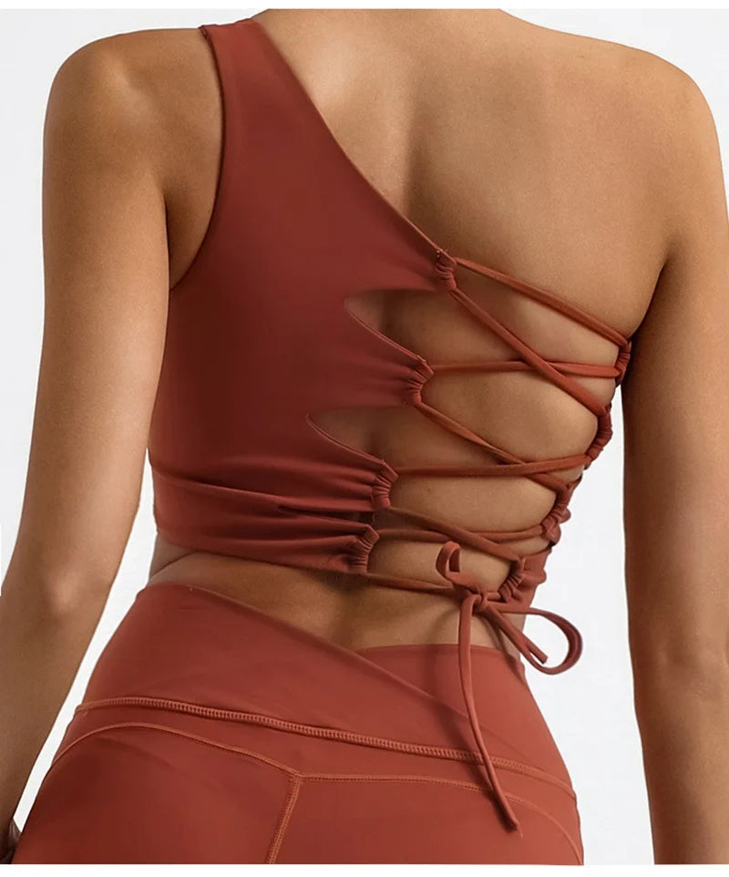 Brown strappy top worn by a person on a white background