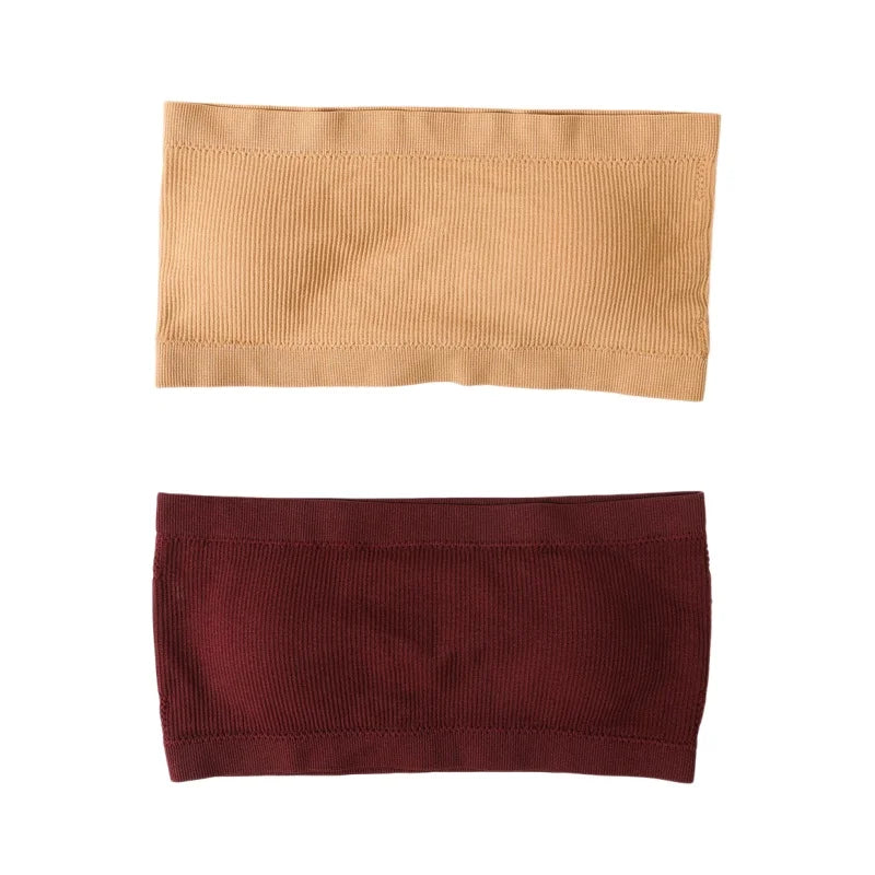 Two fabric headbands shown flat on a white background, one in tan and one in burgundy, both with a ribbed texture and stitched edges.