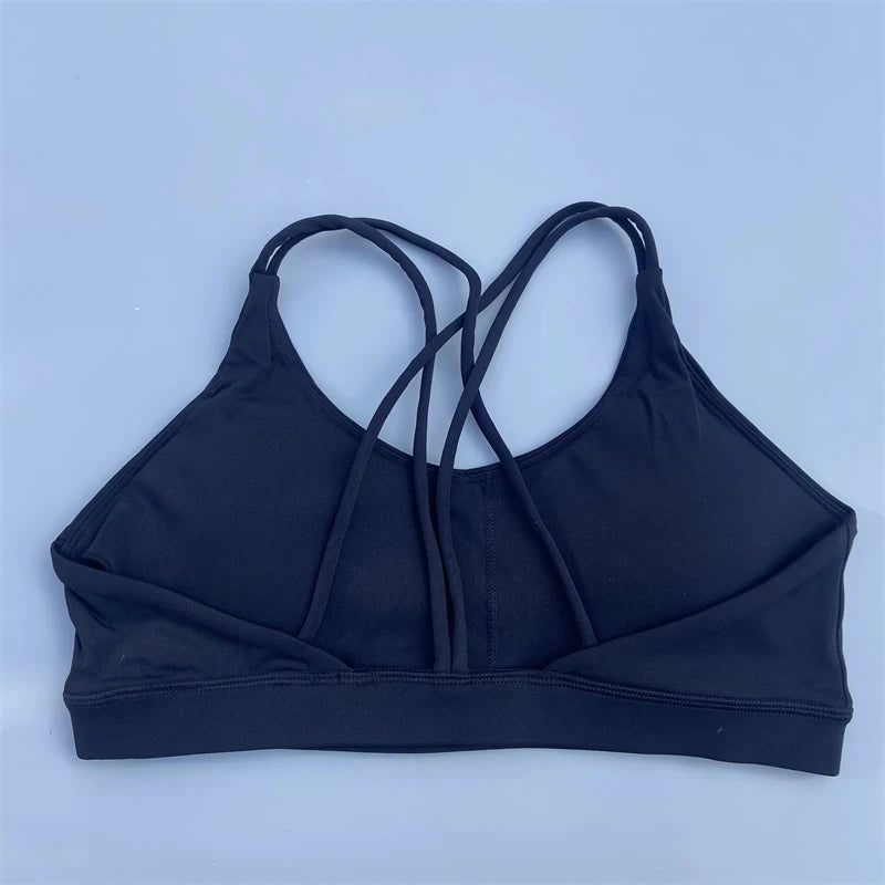 Black sports bra on a light blue background