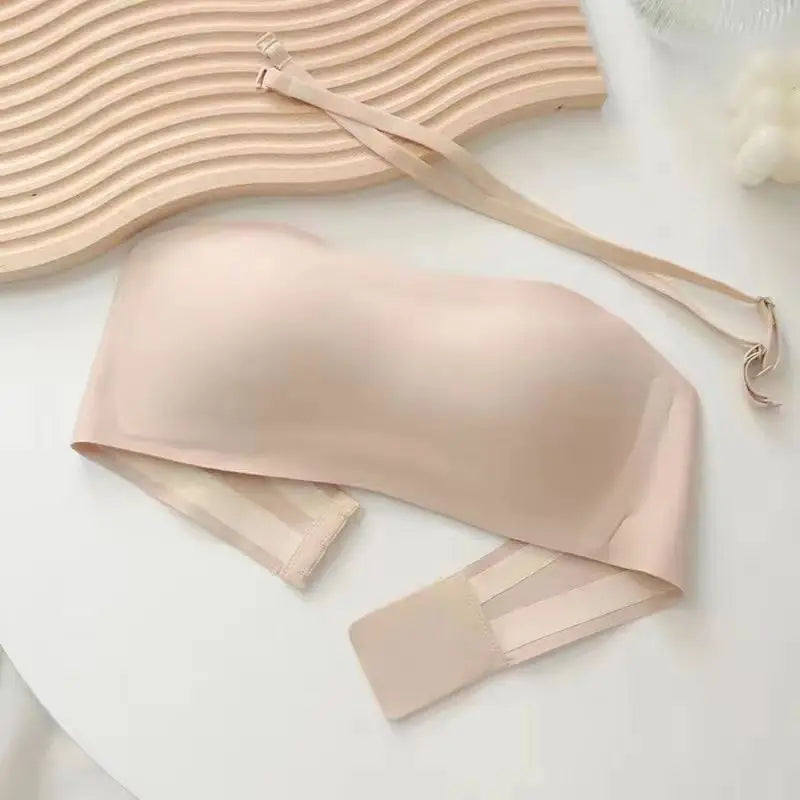 Beige bra on a white surface with a blurred background