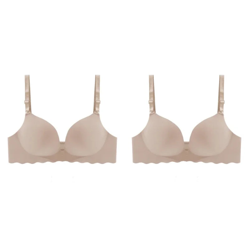Two beige wireless underwire bras with scalloped edges and adjustable shoulder straps, displayed side by side on a plain white background.