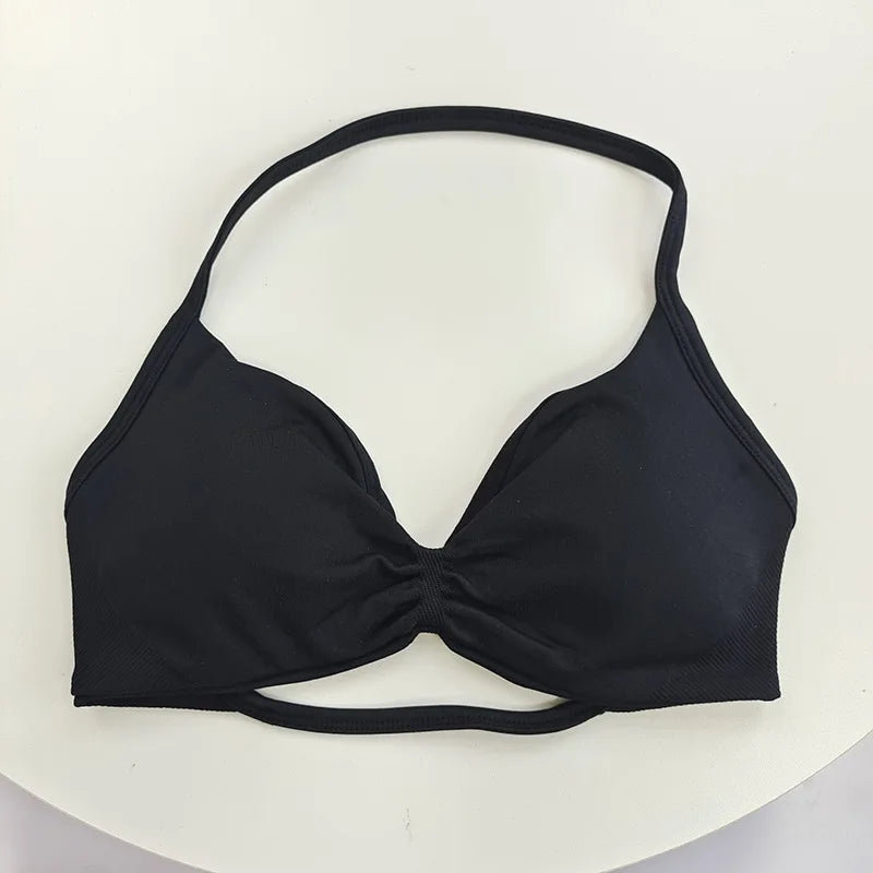 Black bikini top on a white background