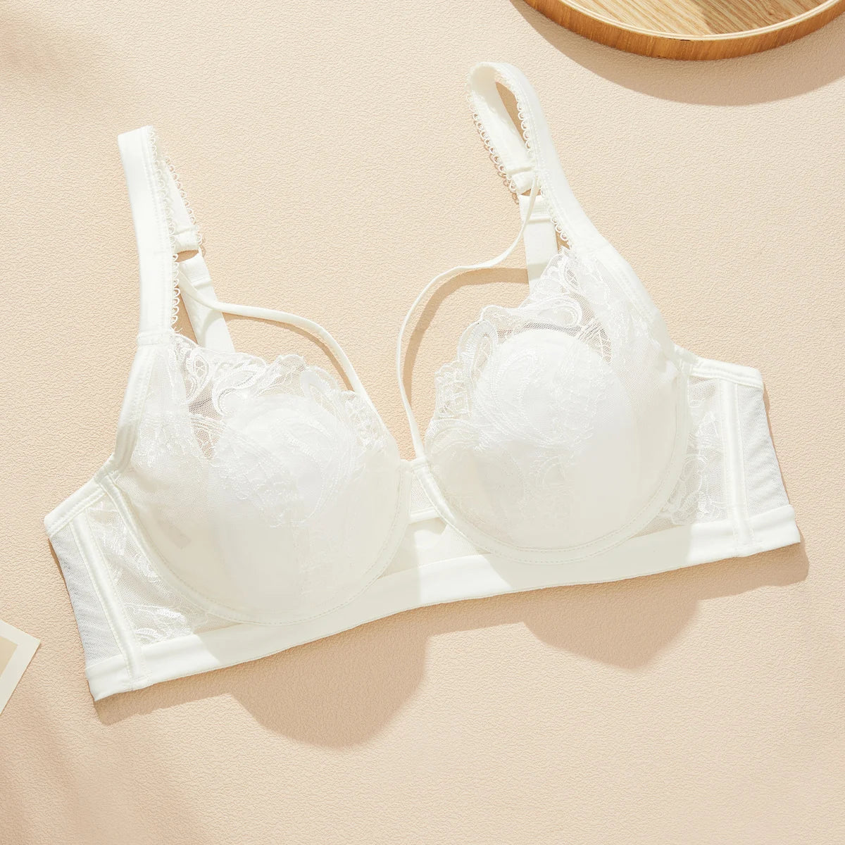White bra on a beige background