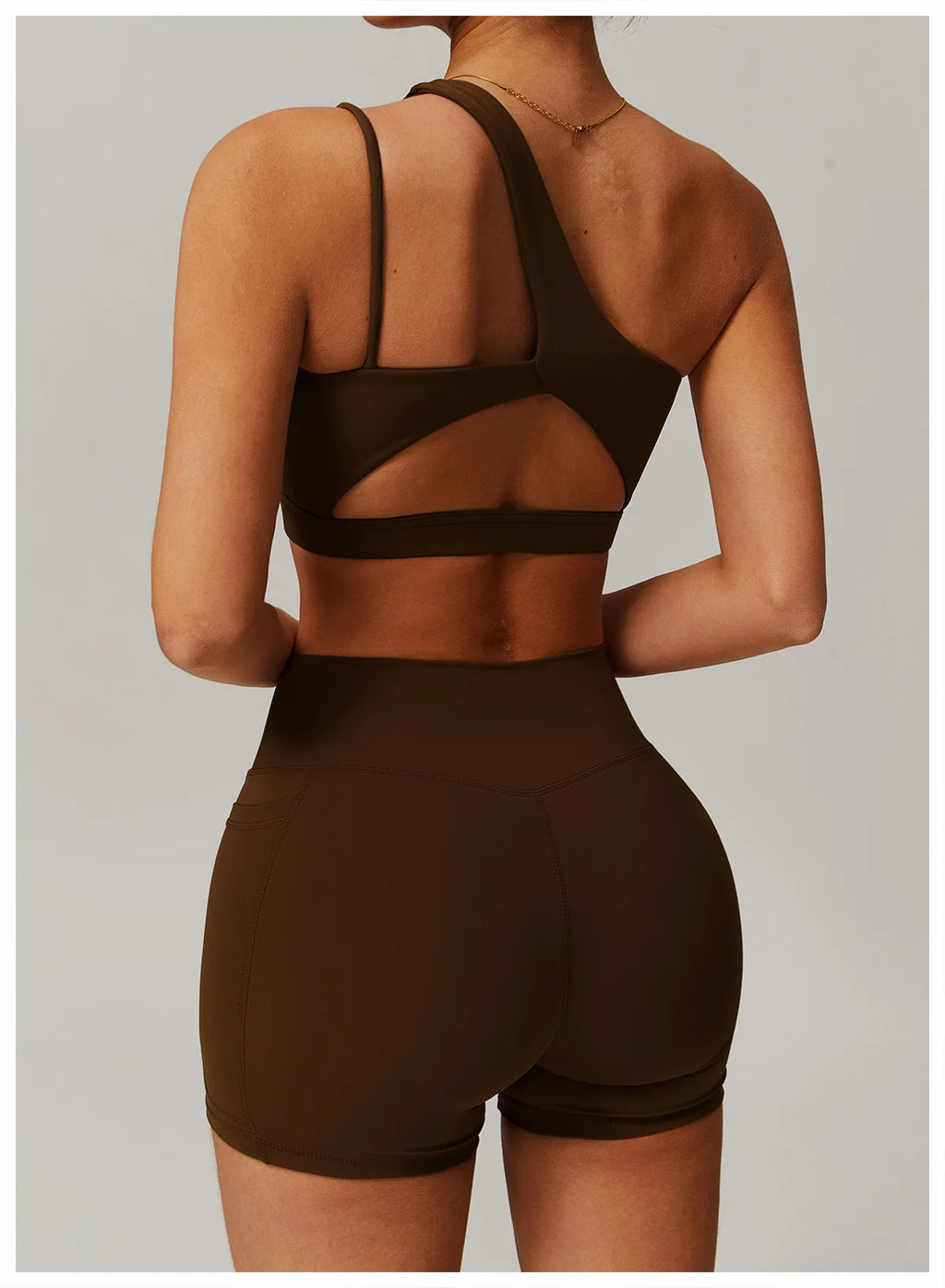 Brown sports bra and shorts set on a neutral background