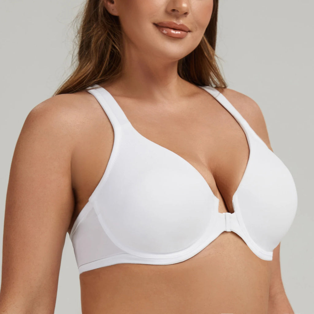 Woman wearing a white bra against a neutral background